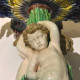 Barbotine centerpiece with putti and conch-shaped basin, 19th, french work