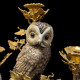 Paire de candélabres représentant deux chouettes en porcelaine montée